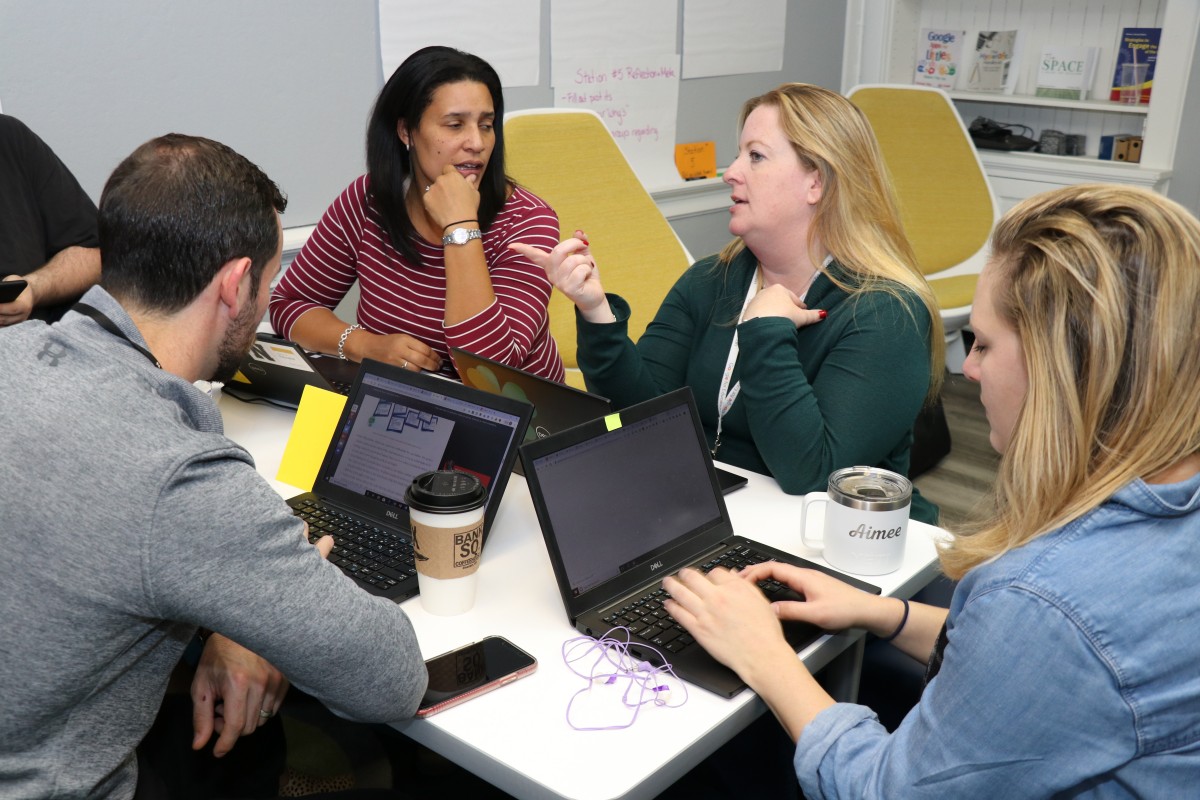 Teachers engage in professional development exercises.