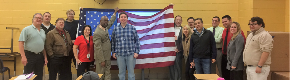 NFA History Department poses with flag