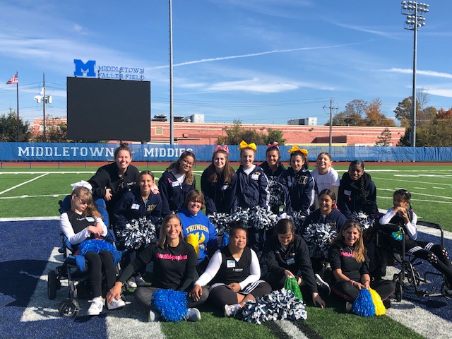 NFA cheerleaders and Beautiful People cheerleaders pose for a photo.