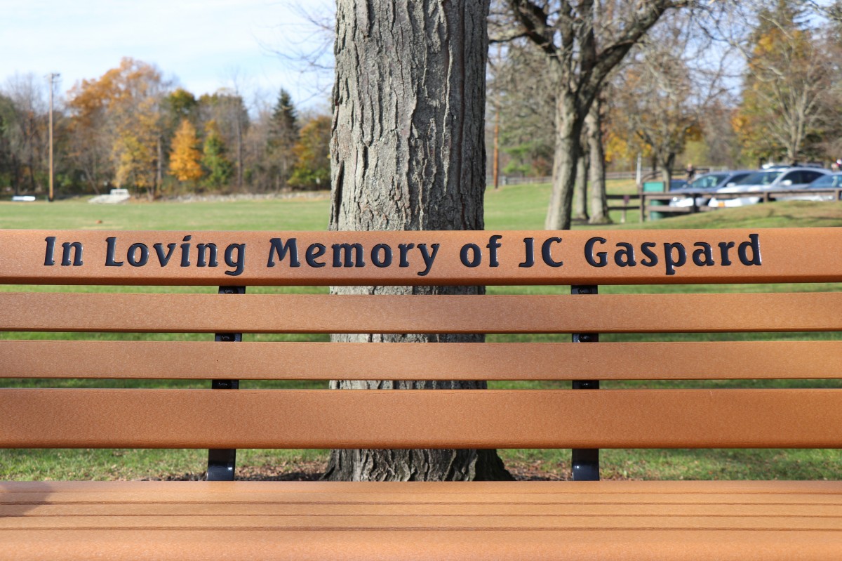 Bench dedication and inscription: In Loving Memory of JC Gaspard.