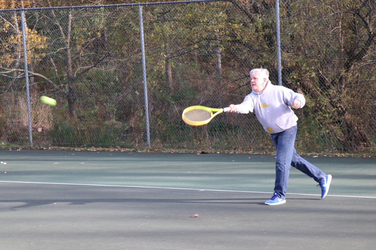 Participant playing tennis.