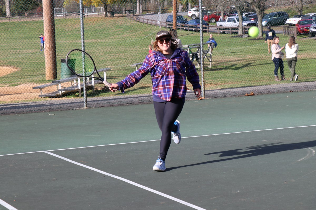 Participant playing tennis.