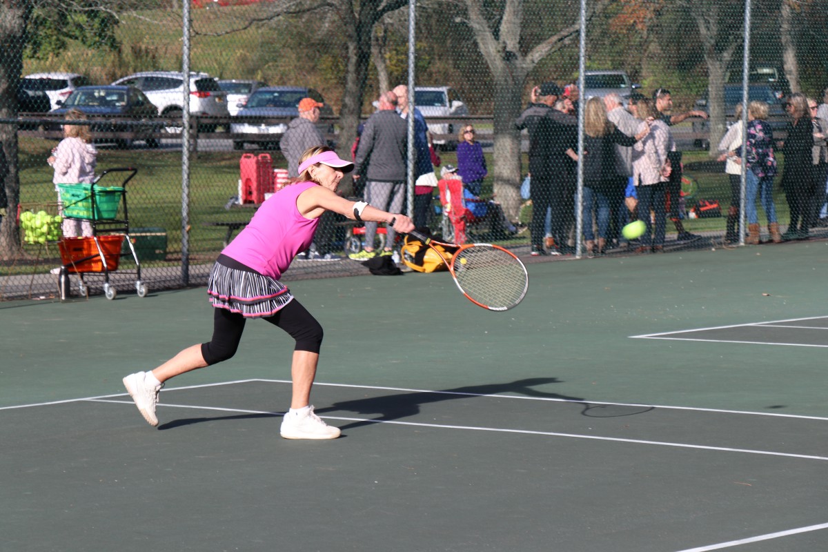 Participant playing tennis.