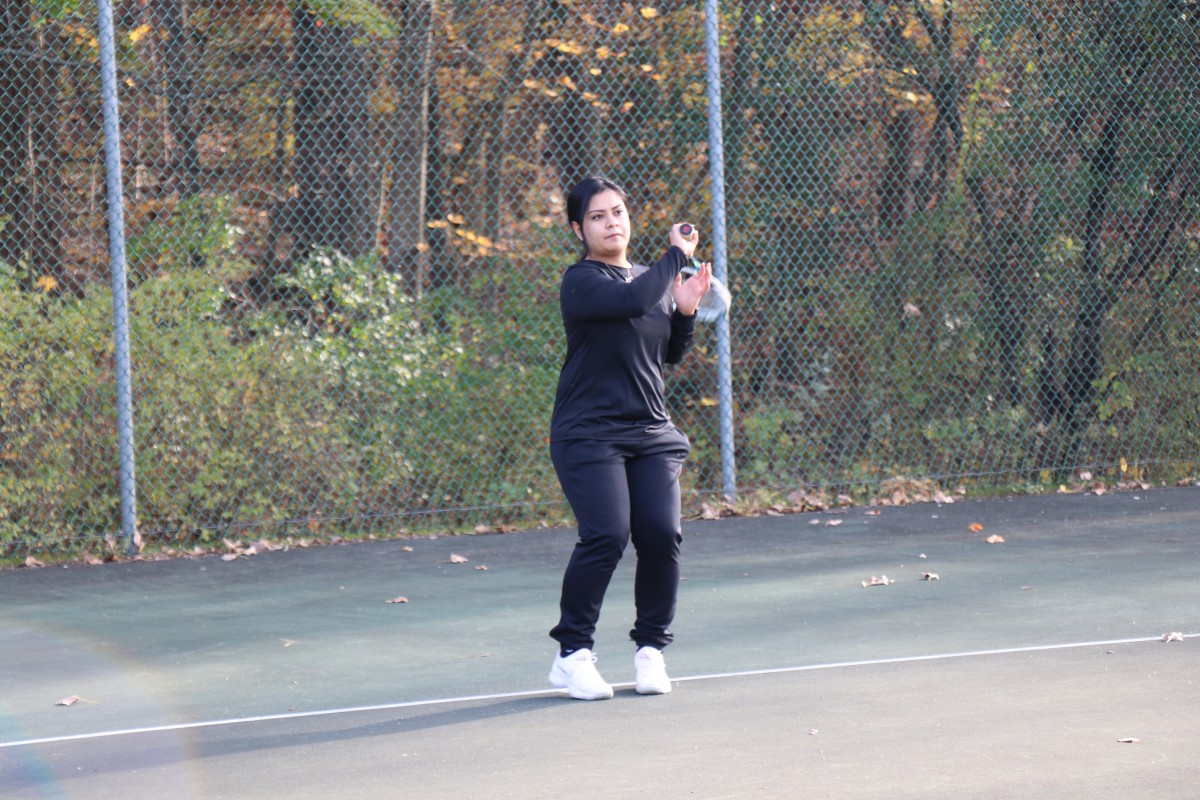 Participant playing tennis.