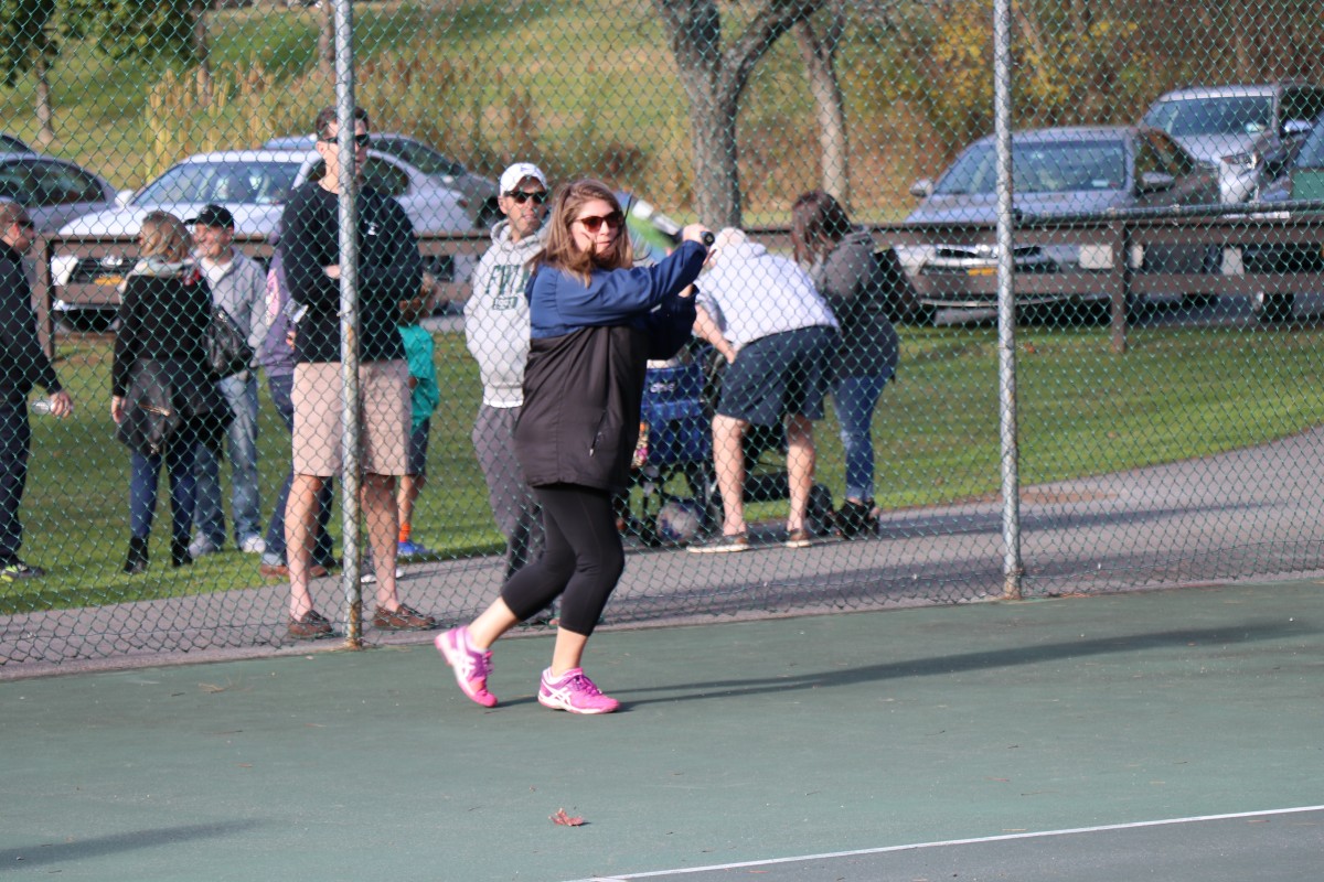 Participant playing tennis.