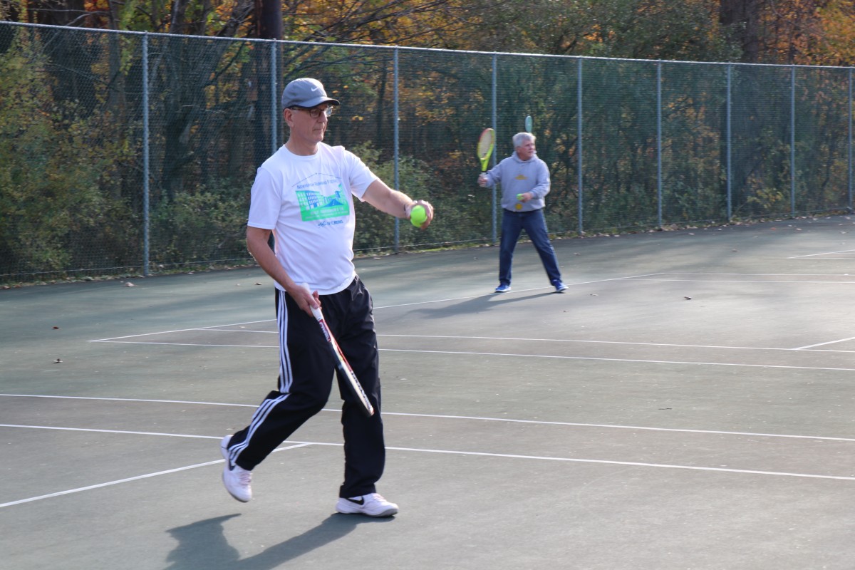 Participant playing tennis.