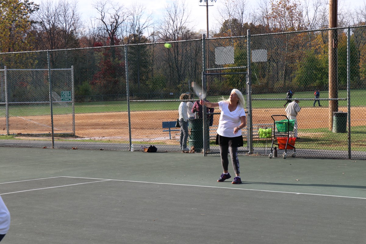 Participant playing tennis.