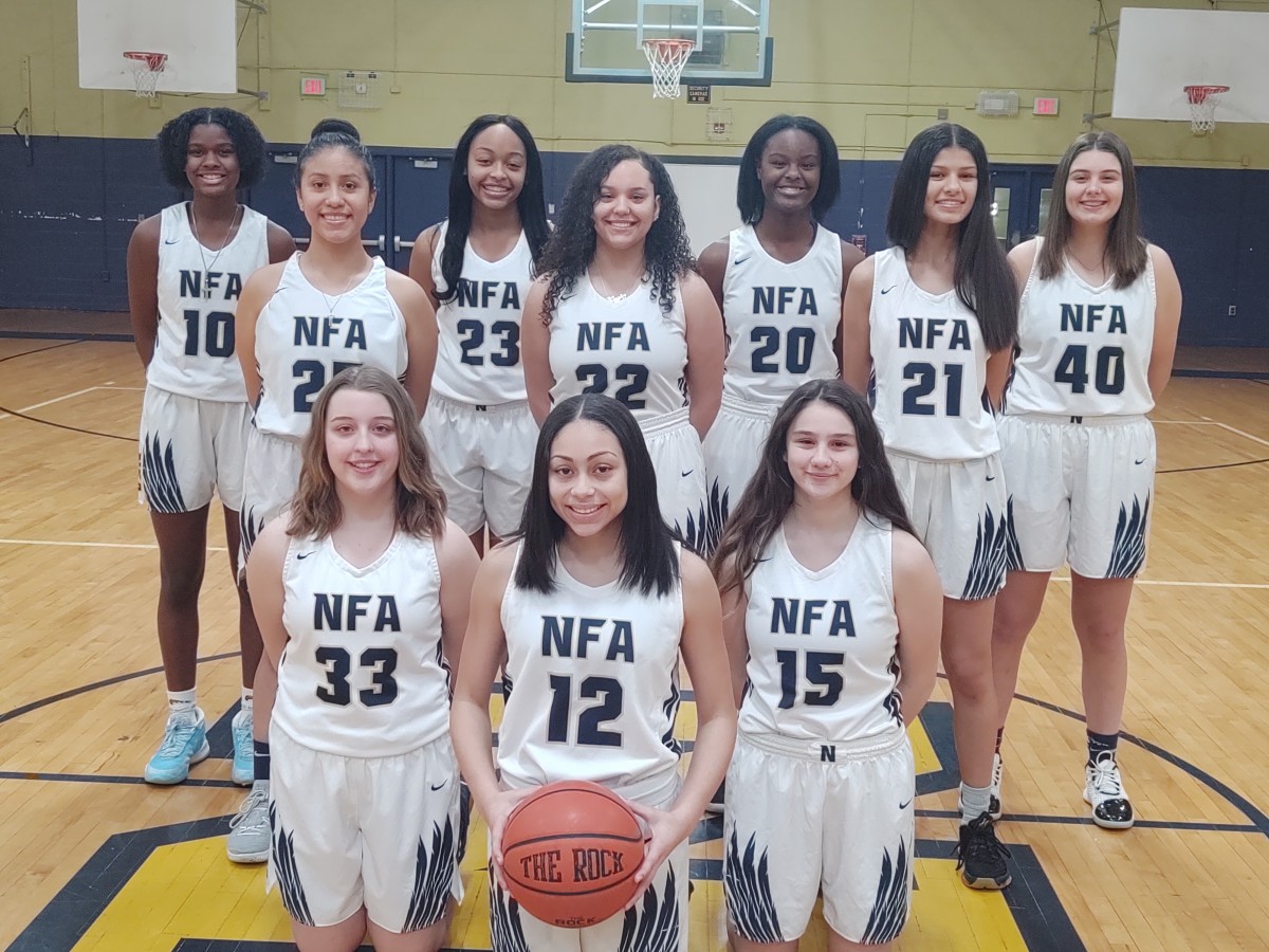 NFA Girls Basketball team poses for a photo.