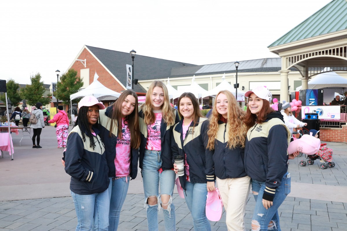 Team poses for a photo at annual Breast Cancer Walk.