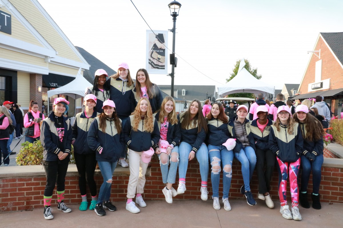 Team poses for a photo at annual Breast Cancer Walk.