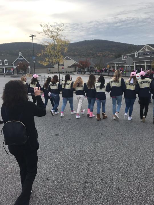 Team poses for a photo at annual Breast Cancer Walk.