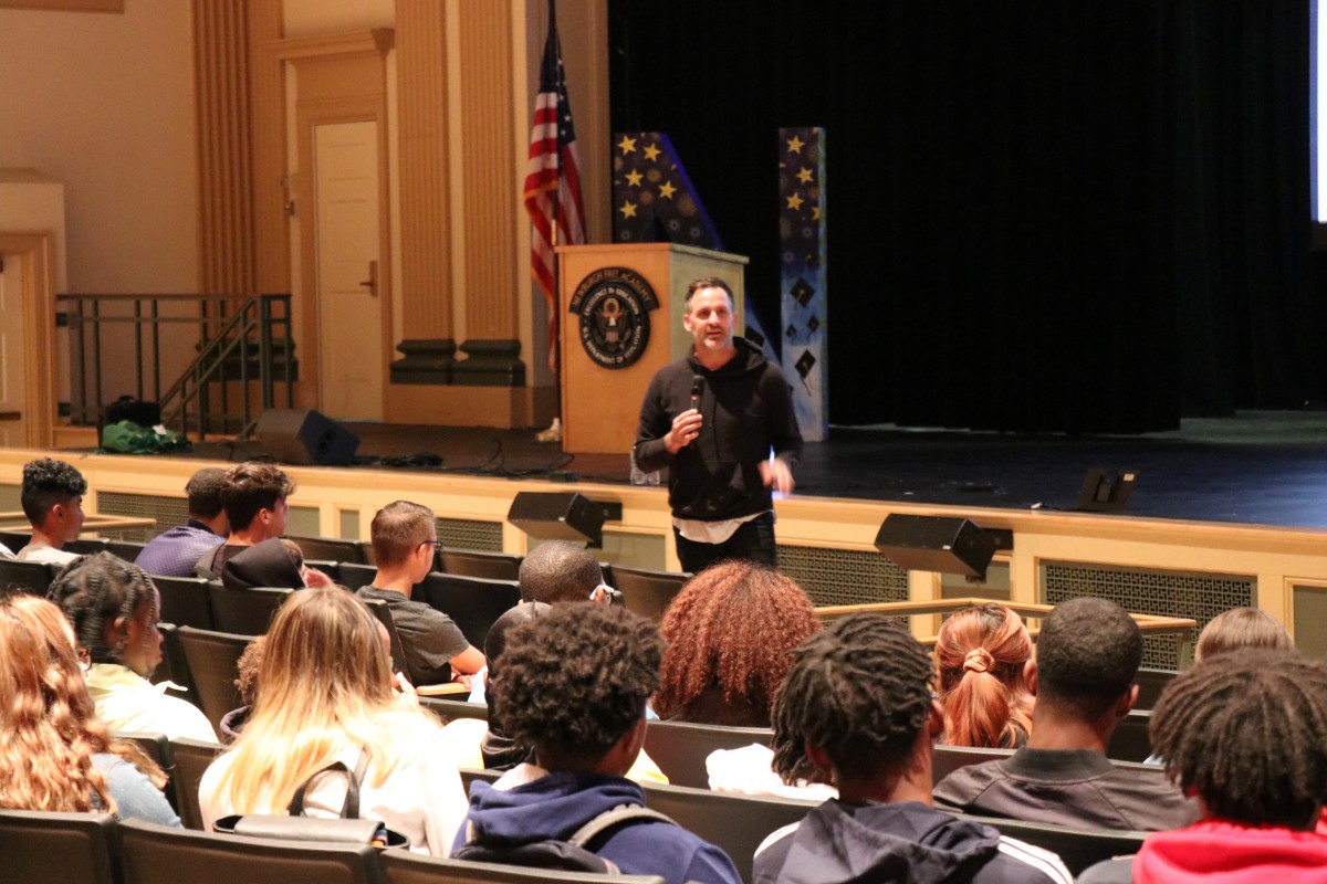 Presenter Cody Hodges addresses the audience.