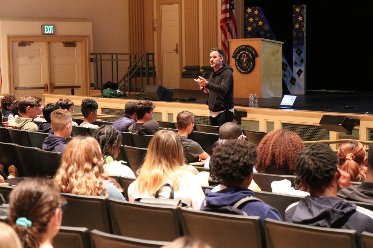 Presenter Cody Hodges addresses the audience.