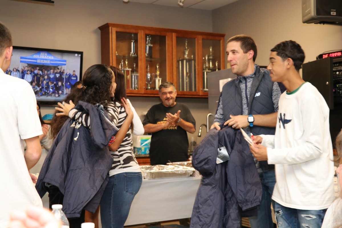 Coaches opening gifts