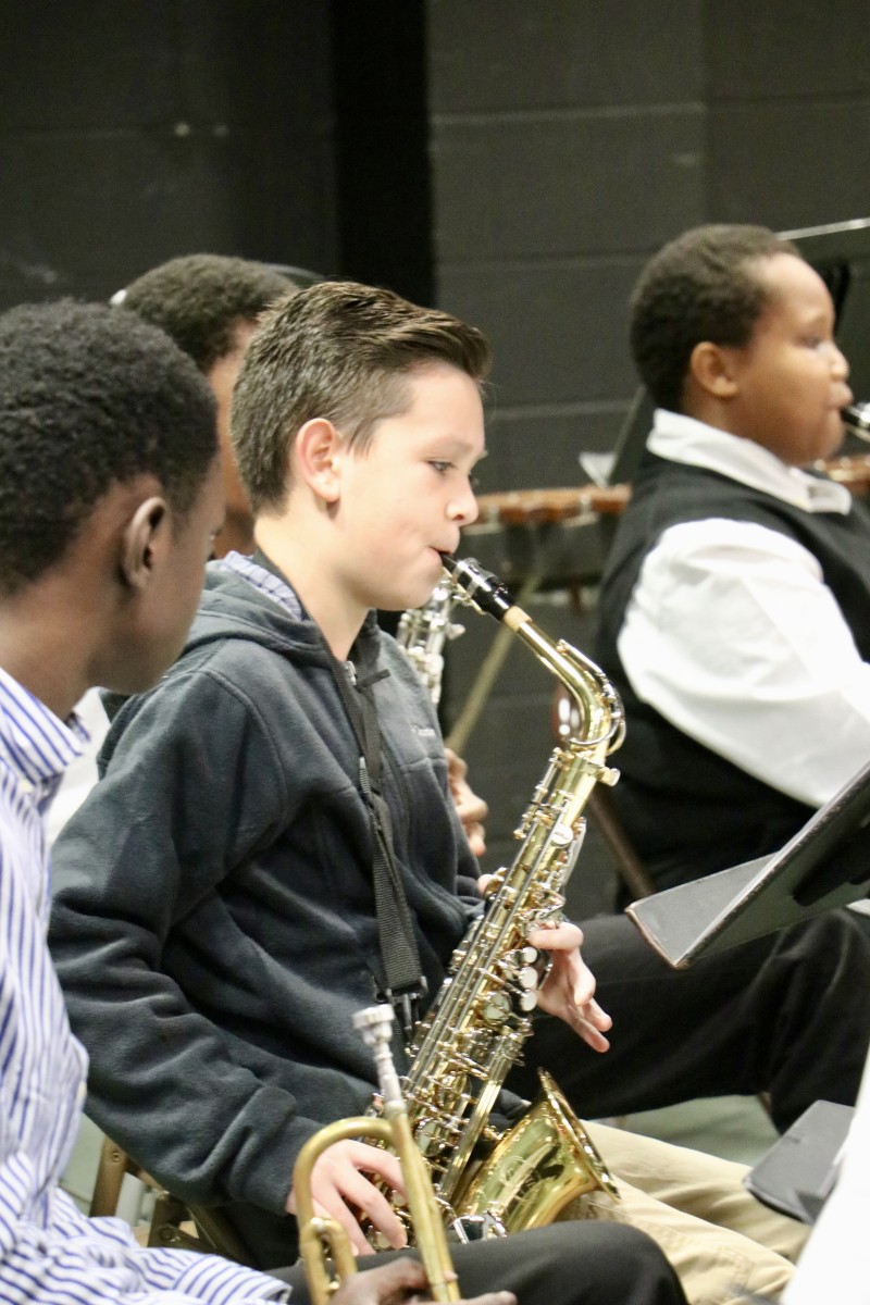 Student plays saxophone