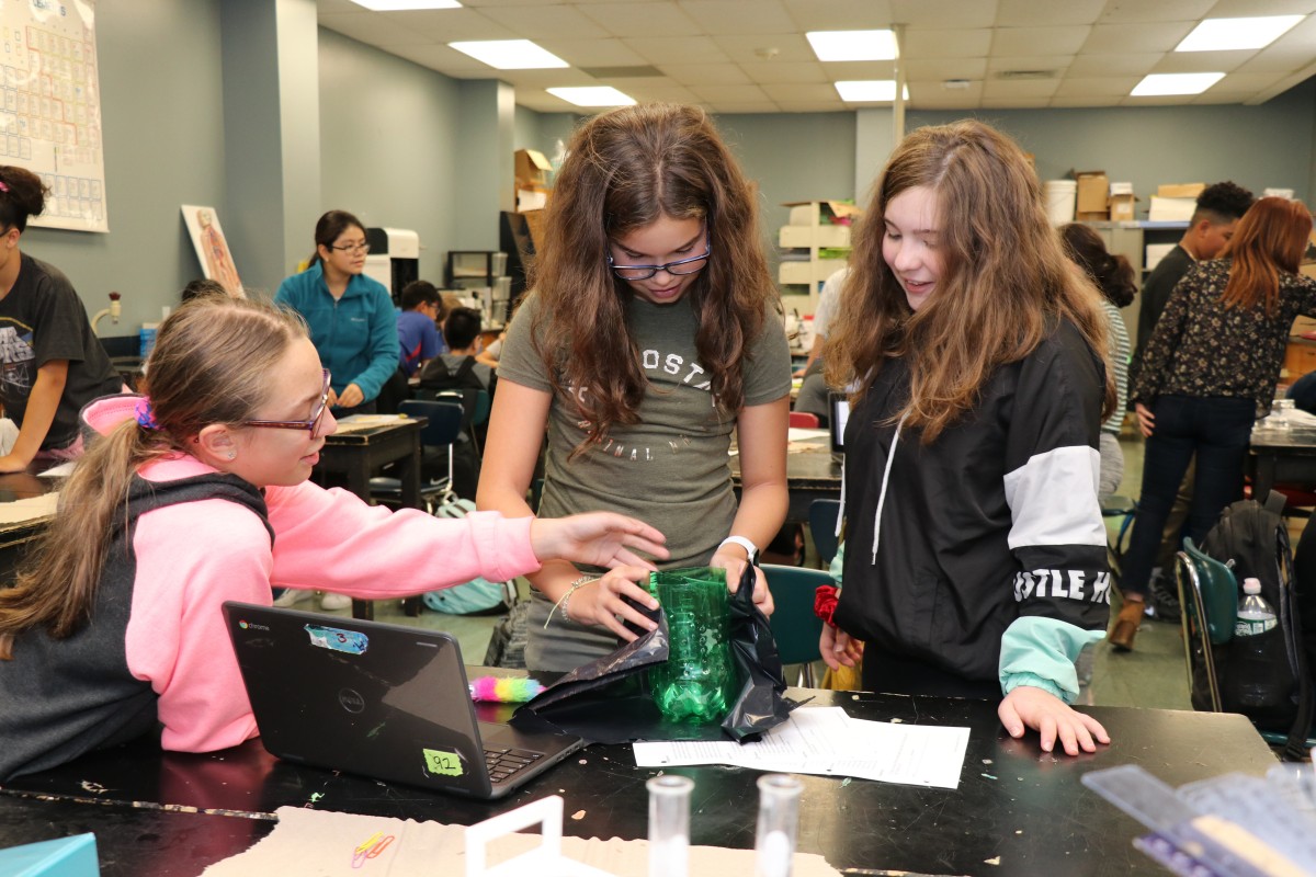 Students work together to build a mosquito trap.