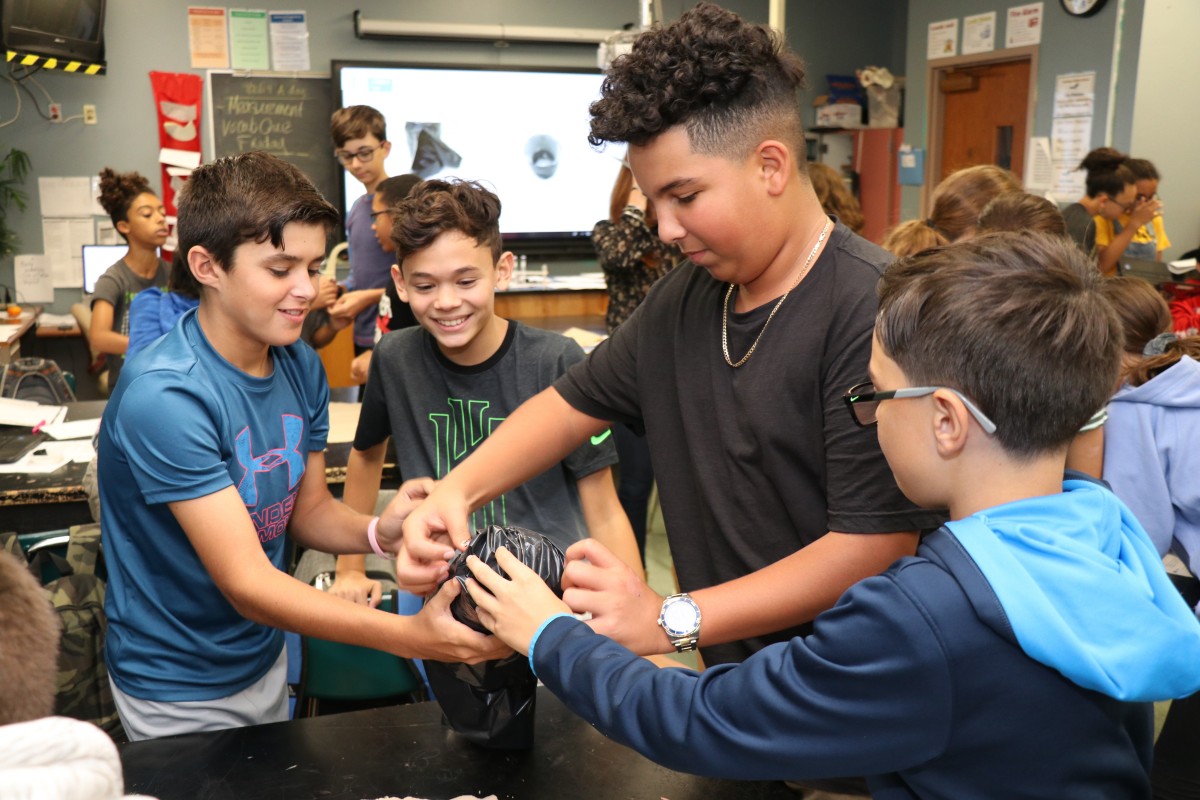 Students work together to build a mosquito trap.