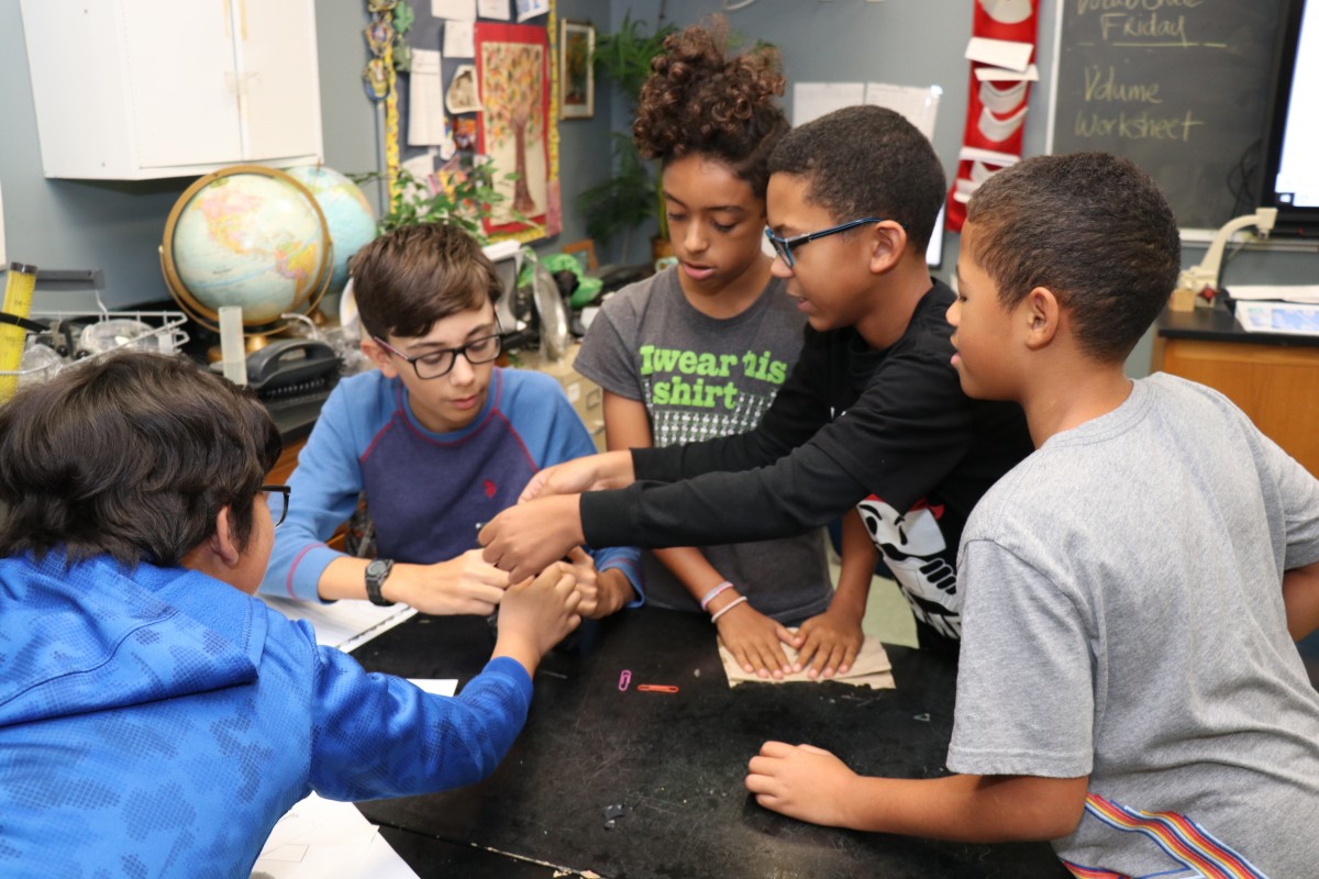 Students work together to build a mosquito trap.