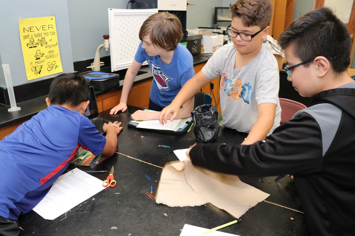 Students work together to build a mosquito trap.