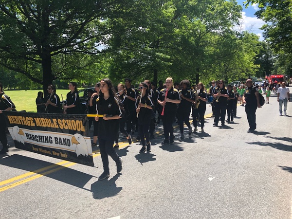 Students marching with banner.