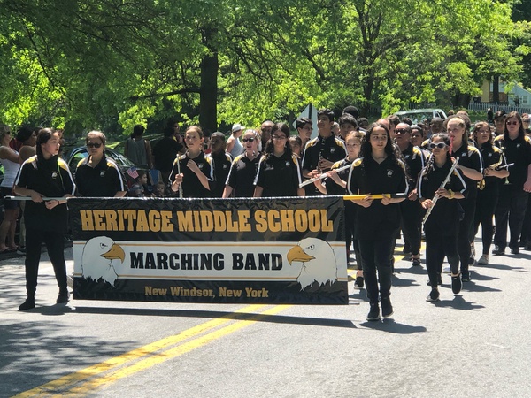 Students marching with banner.