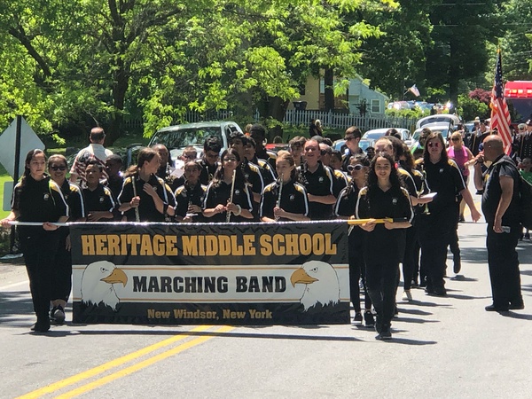 Students marching with banner.