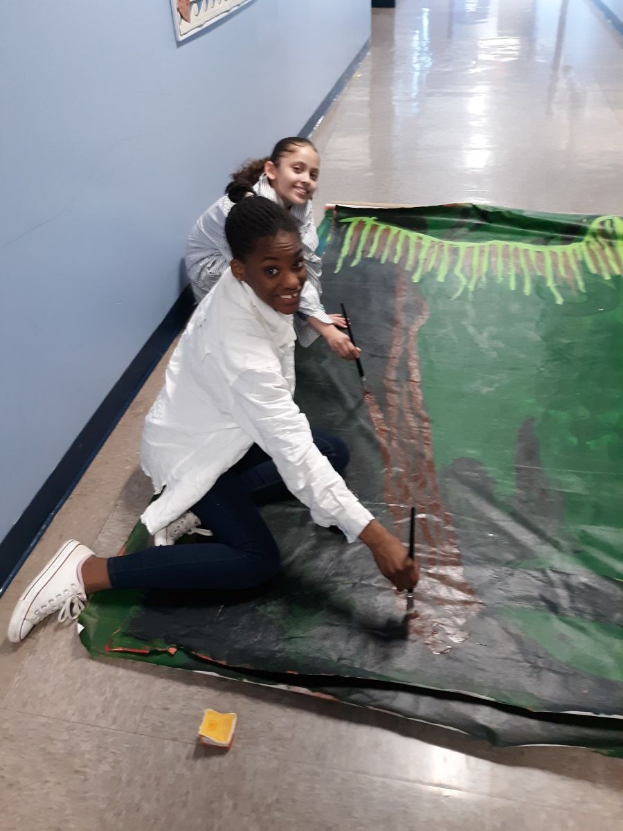 Scholars collaborate to paint sets for Shrek.