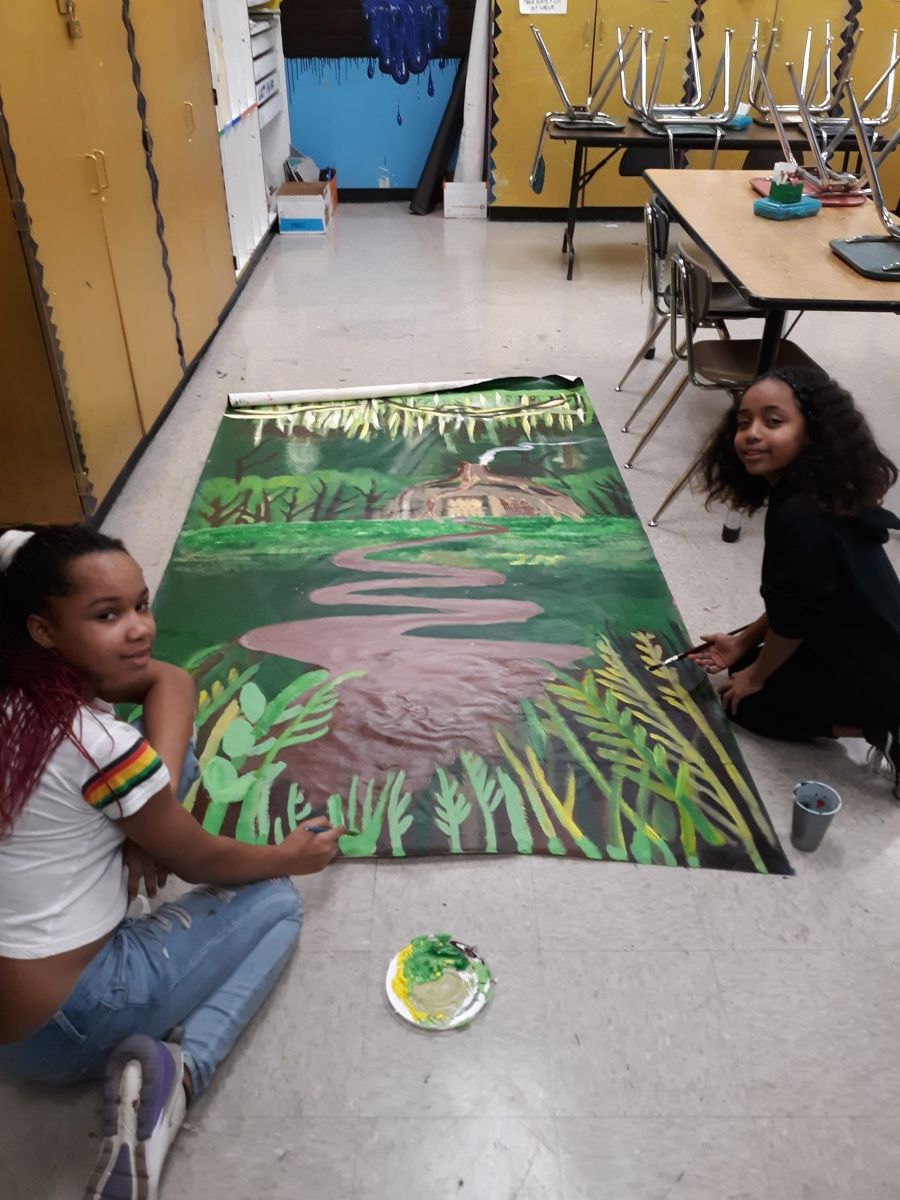 Scholars collaborate to paint sets for Shrek.