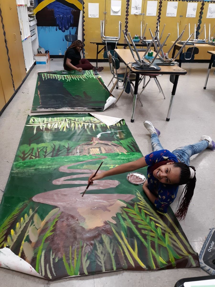 Scholars collaborate to paint sets for Shrek.