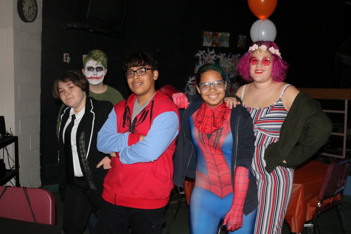 Students pose for a photo in their costume.