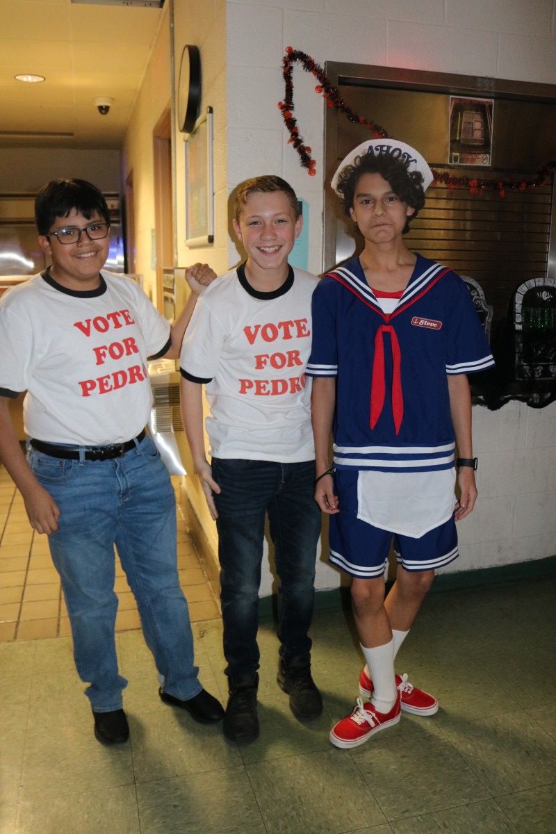 Students pose for a photo in their costume.