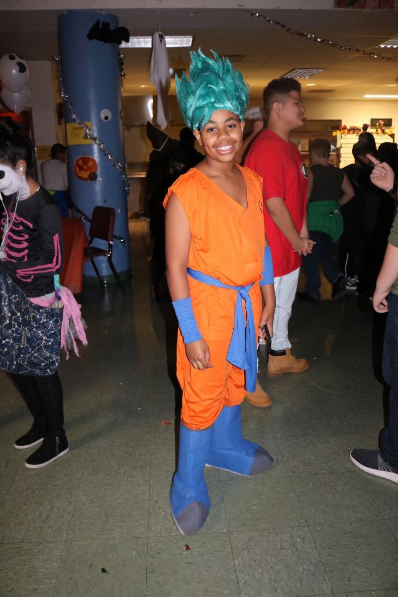 Students pose for a photo in their costume.