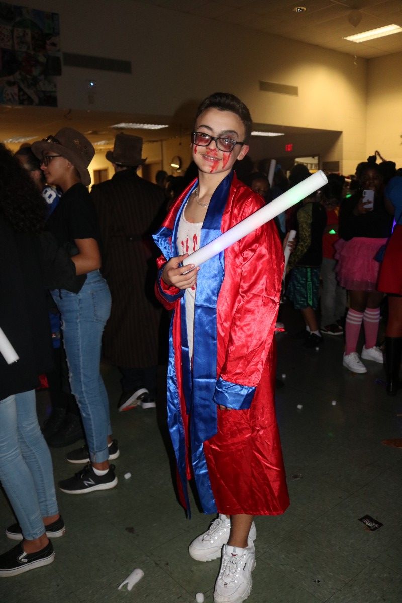 Students pose for a photo in their costume.