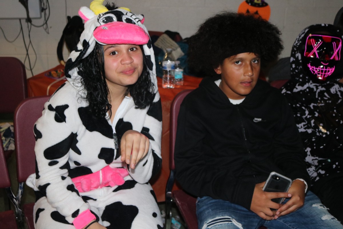 Students pose for a photo in their costume.