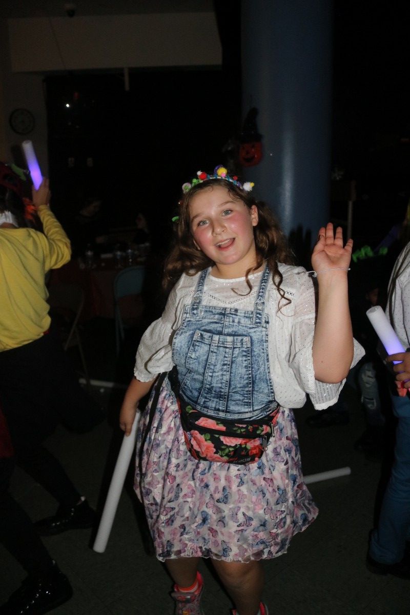 Students pose for a photo in their costume.