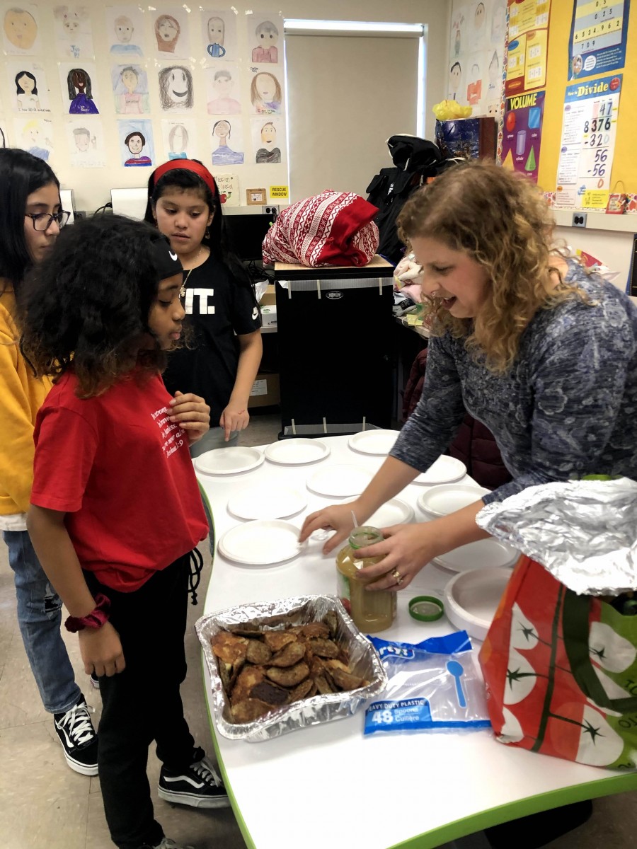 Classroom visitor demonstrates to students.