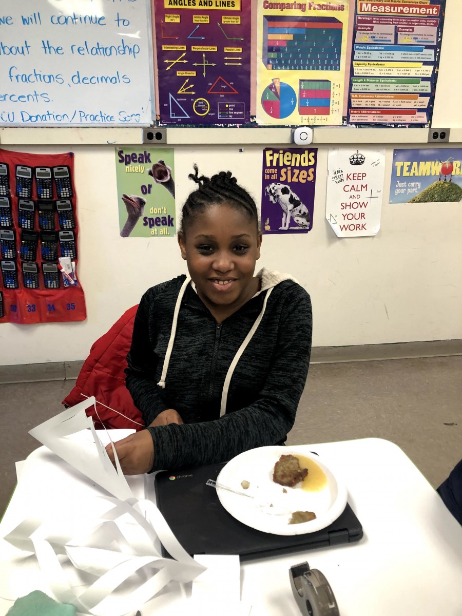 Student with plate of food.