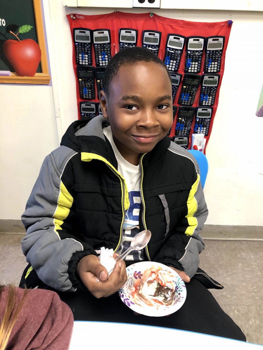 Student enjoying ice cream sundae.