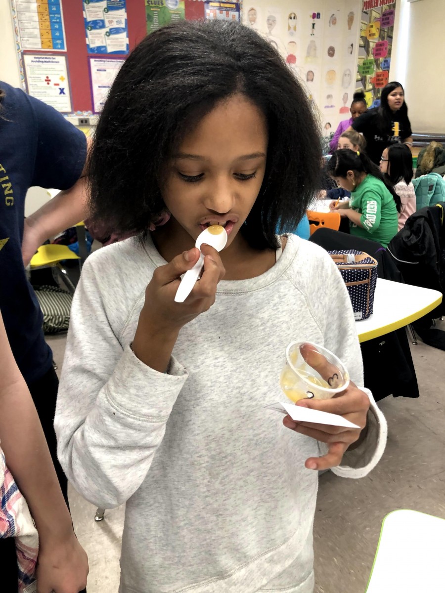 Student testing and guessing baby food during game.