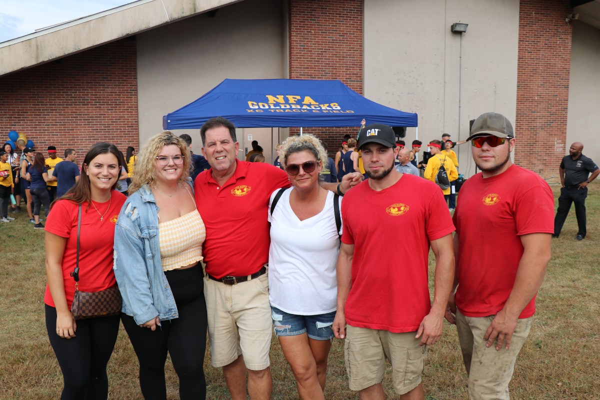 Lynn Warren poses with family and staff.