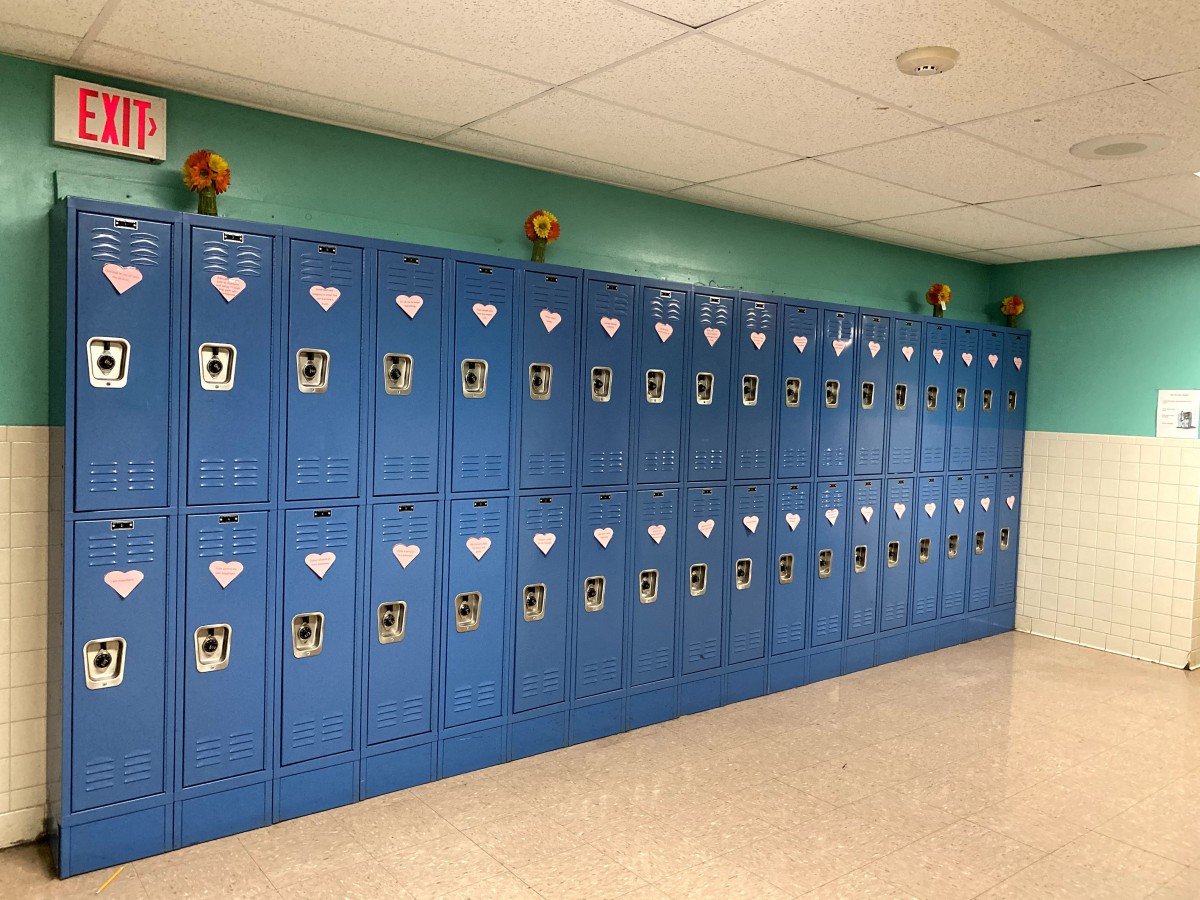 Row of lockers with affirmations on it.