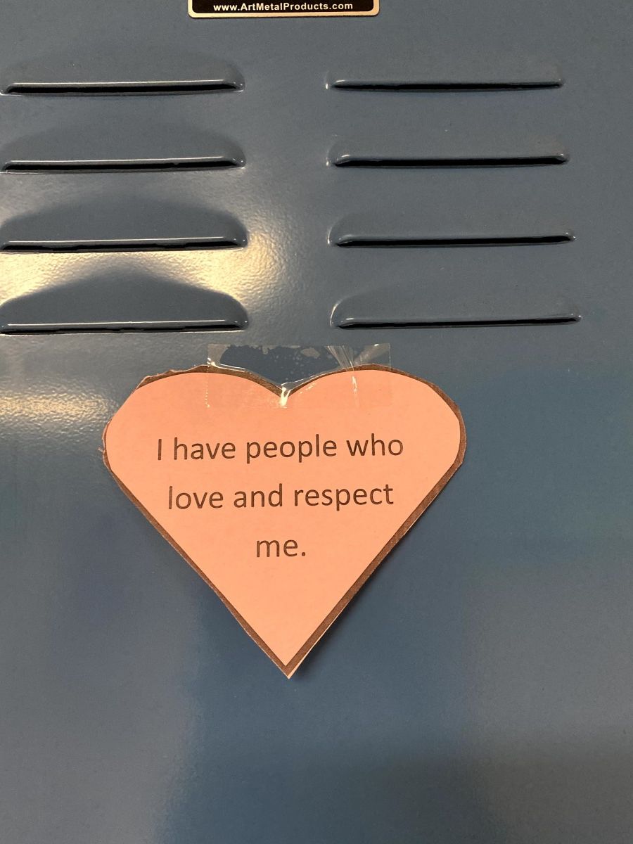 Affirmation in a heart stuck to a locker.