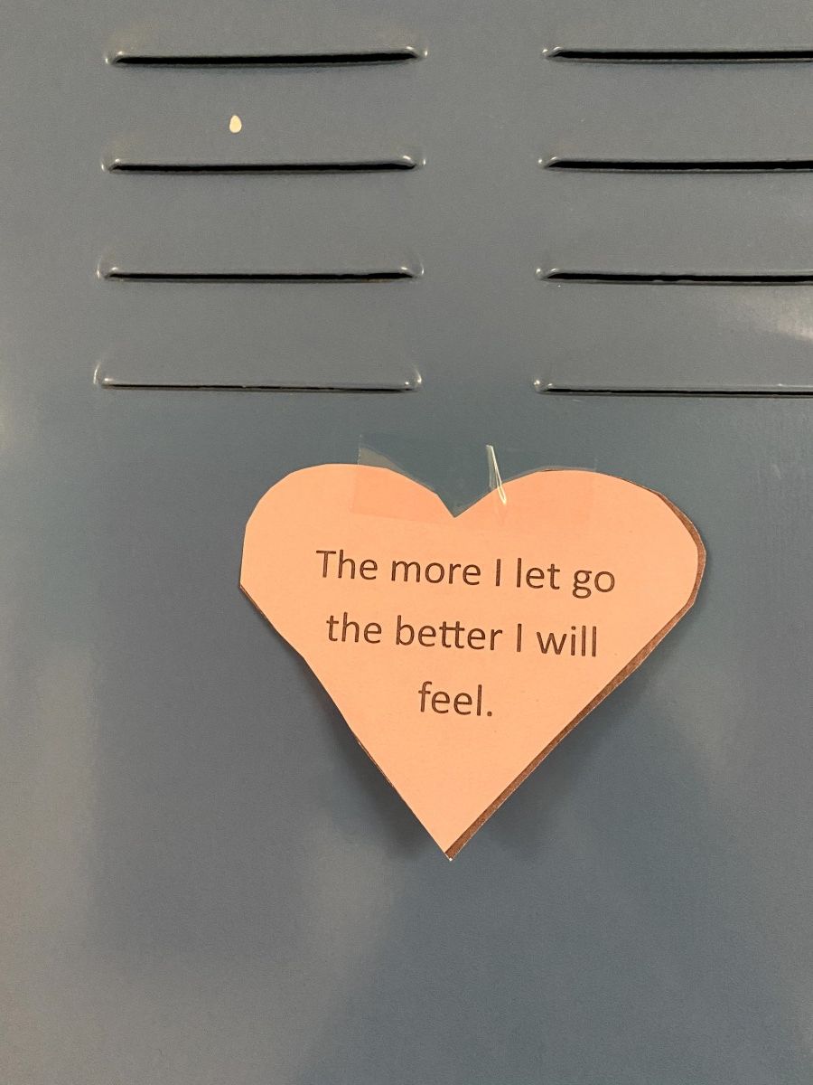 Affirmation in a heart stuck to a locker.