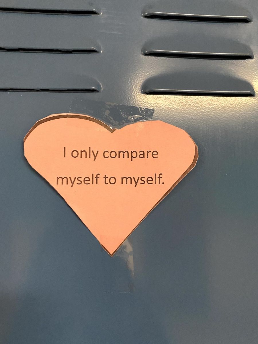 Affirmation in a heart stuck to a locker.