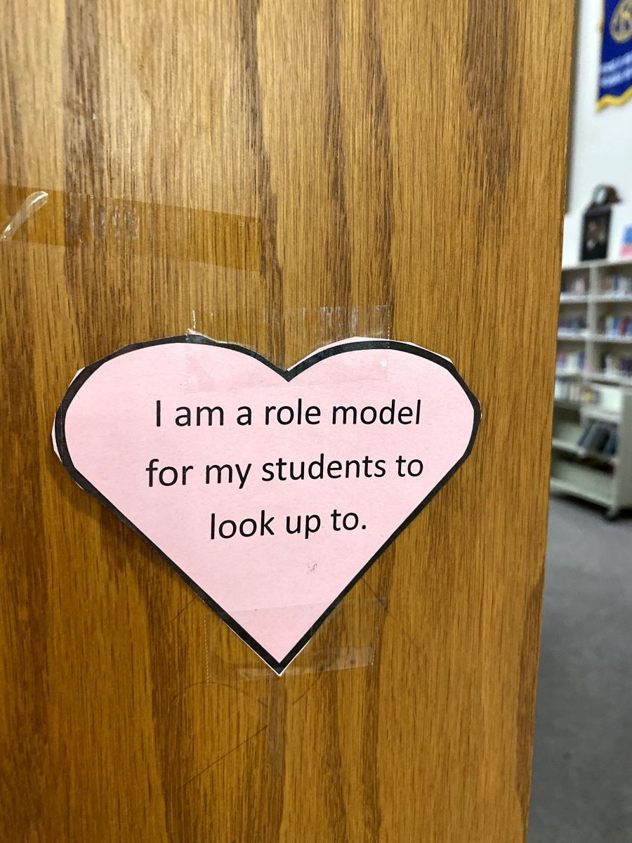 Affirmation in a heart stuck to a locker.