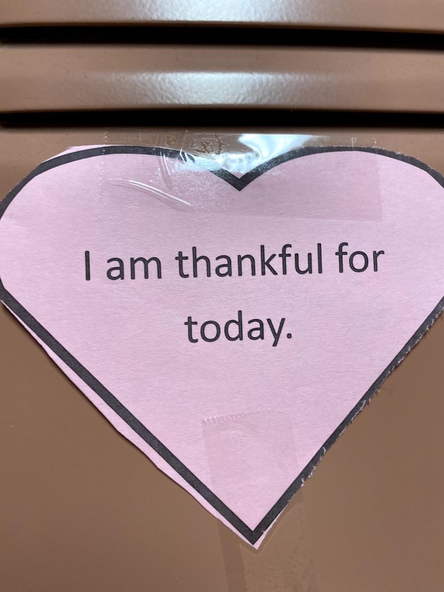 Affirmation in a heart stuck to a locker.