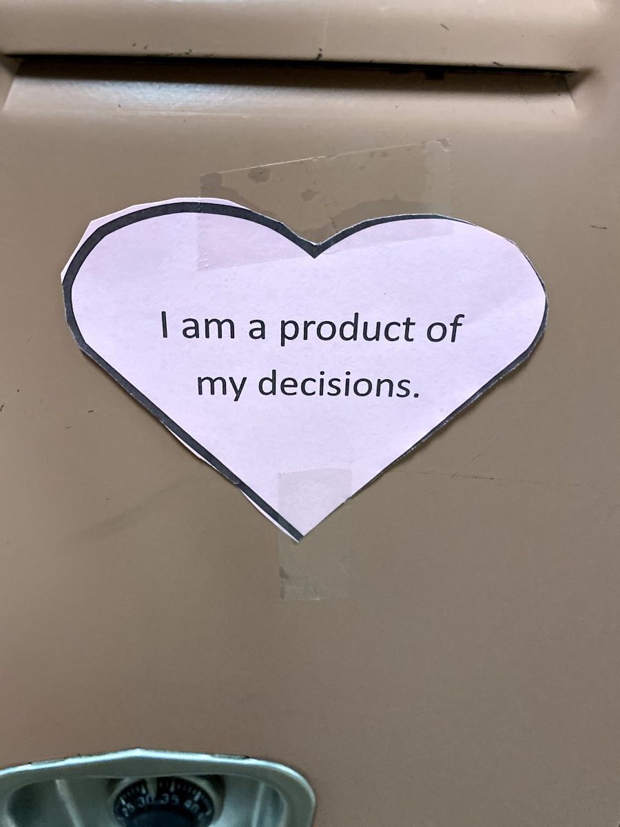 Affirmation in a heart stuck to a locker.