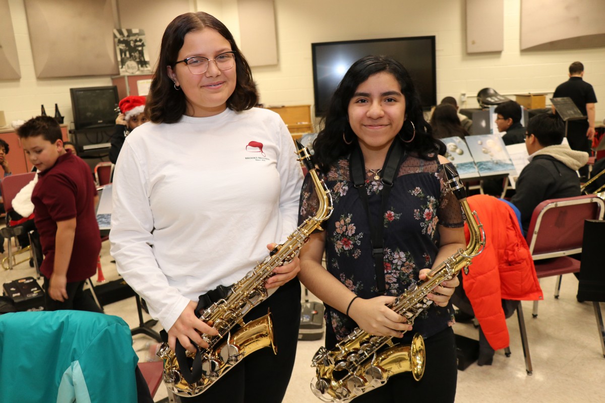 Students pose for a photo with their instruments.