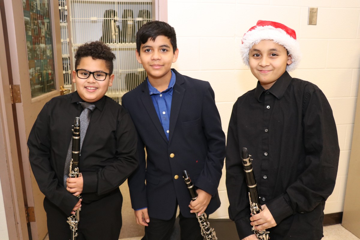 Students pose for a photo with their instruments.