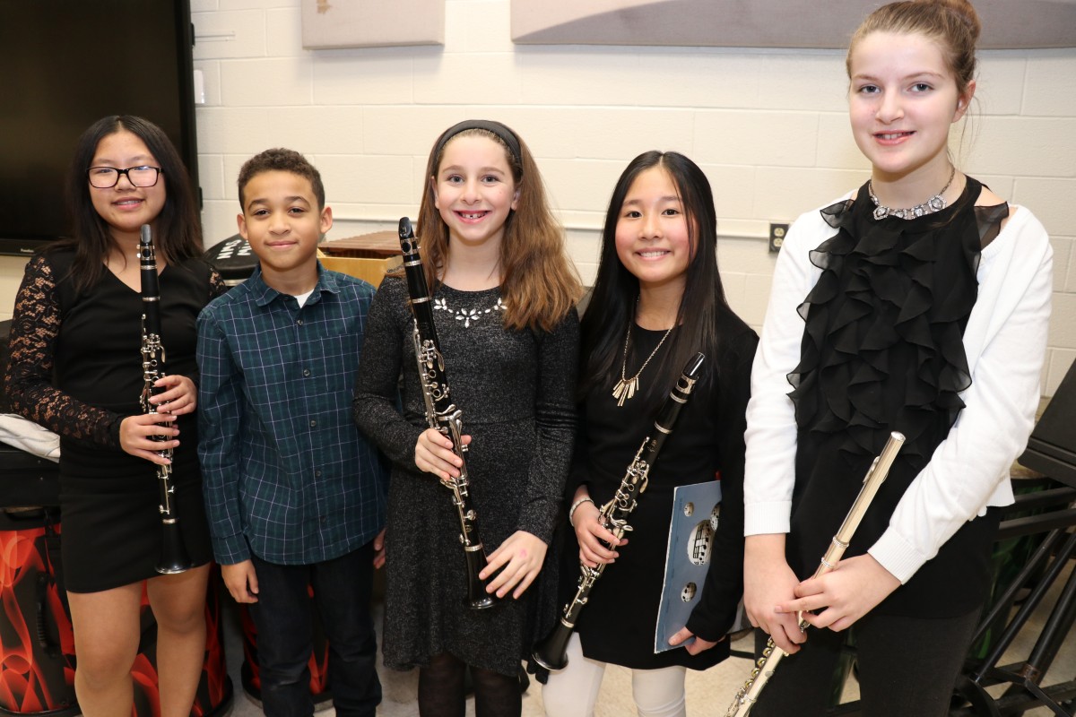 Students pose for a photo with their instruments.